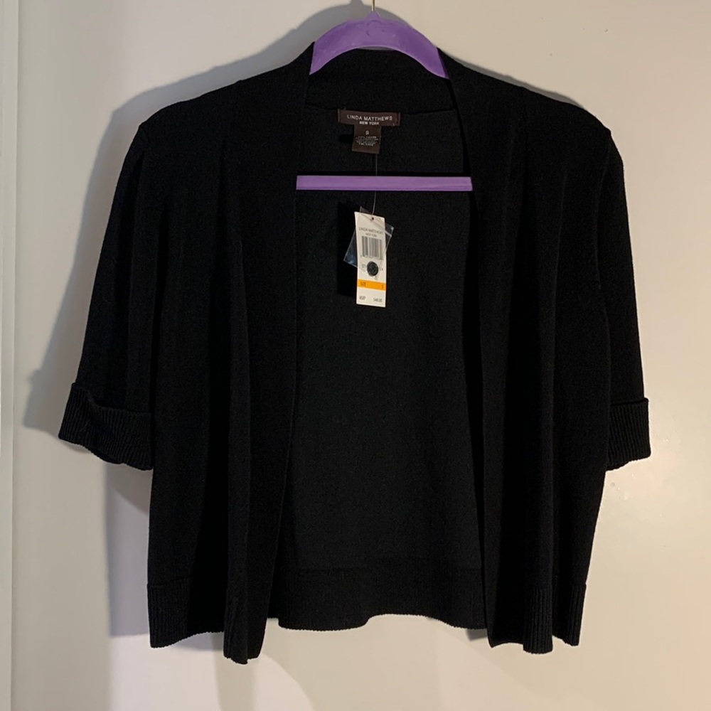 LINDA MATHEWS Short short sleeve black sweater. Shrug NWT button cuff detail S
